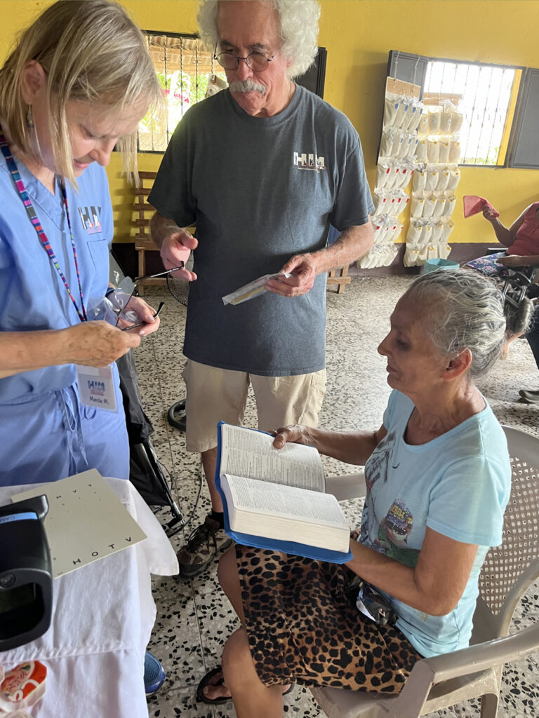 Marcia McGinnis and Steve Roche providing vision care to a patient at a pop up vision clinic Guatemala. 2