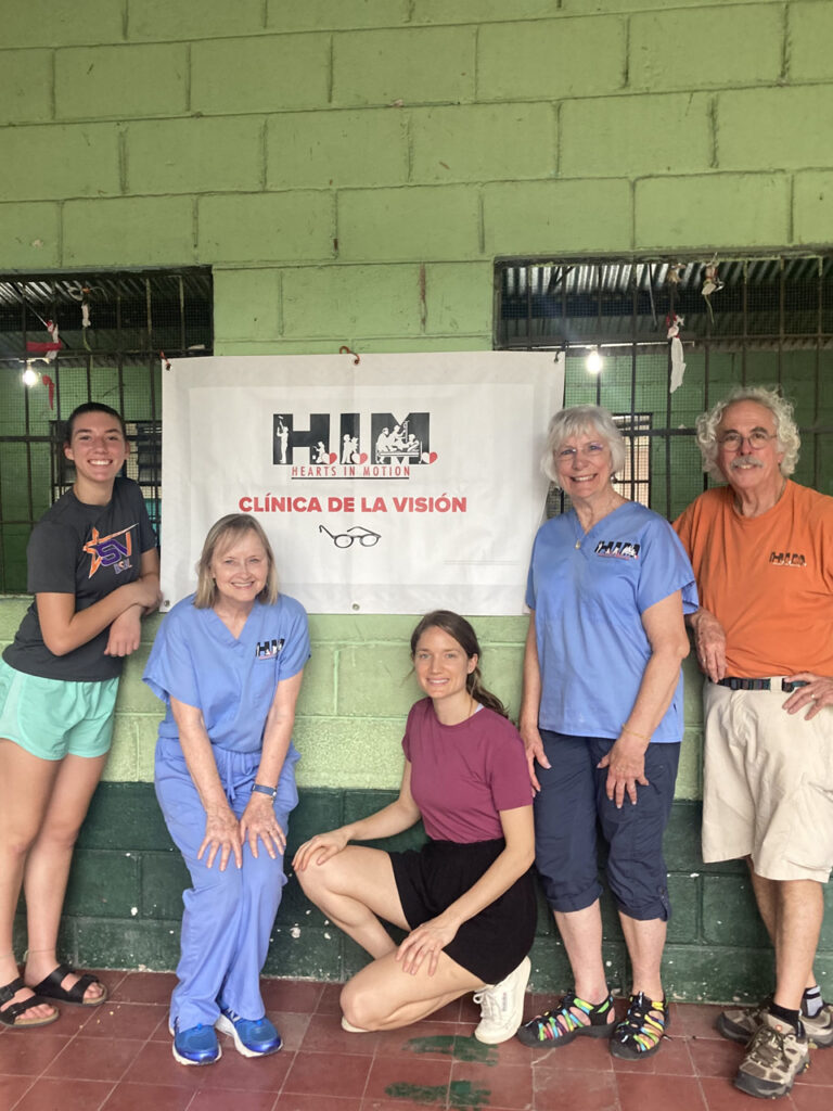 Vision team group picture at a pop up clinic