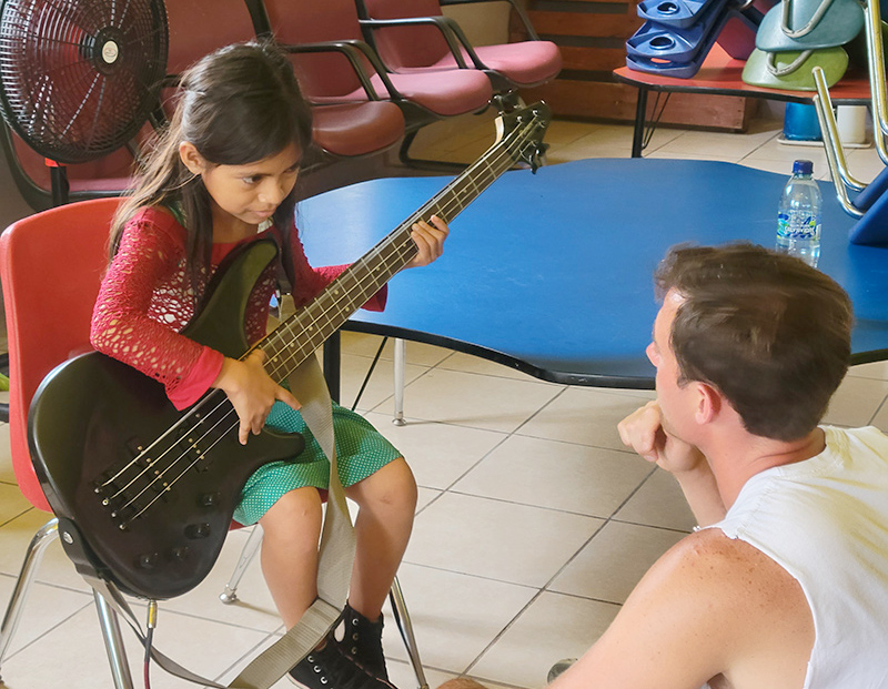 Music In Motion student with teacher at music camp.