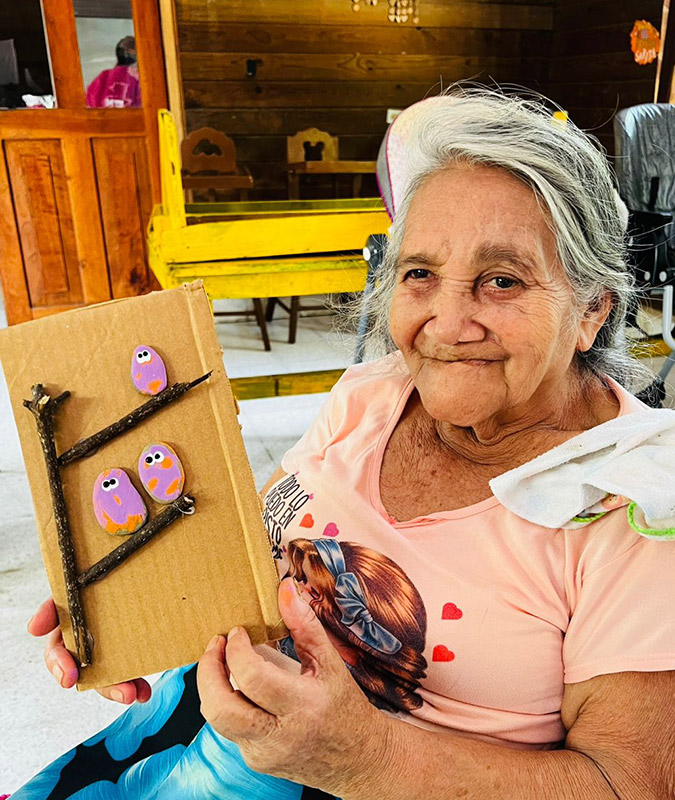 HIM senior citizen from senior program with artwork she created